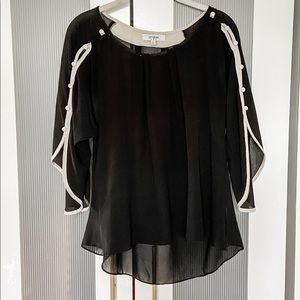 Sheer drapy black blouse with cream button details